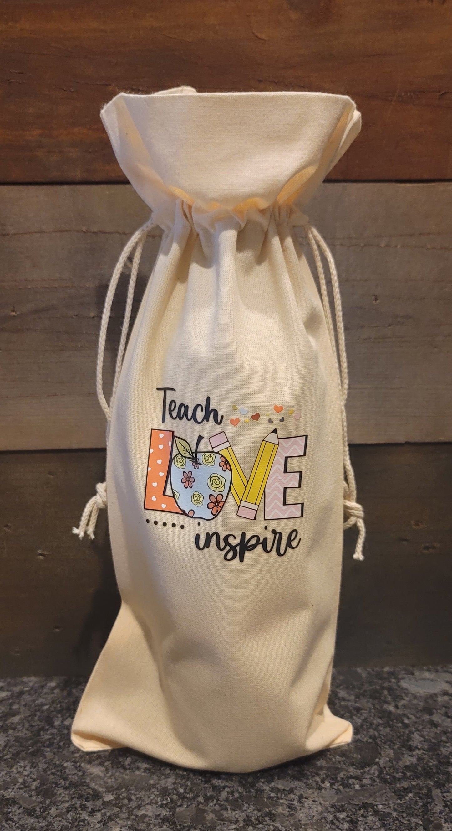 Teach love inspire wine bag