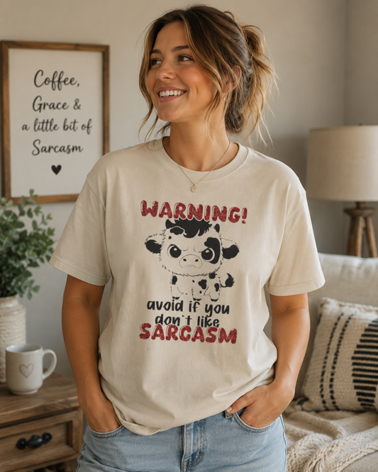T-Shirt — "WARNING! Avoid If You Don't Like Sarcasm" Cute Cow Graphic